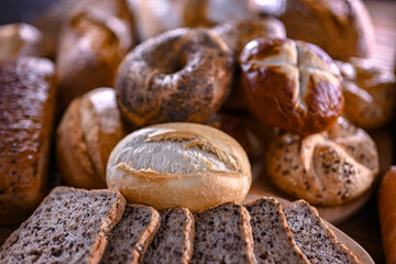Assorted bakery products including loaves of bread and rolls