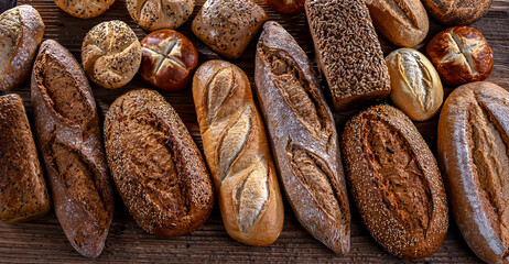 Assorted bakery products including loaves of bread and rolls