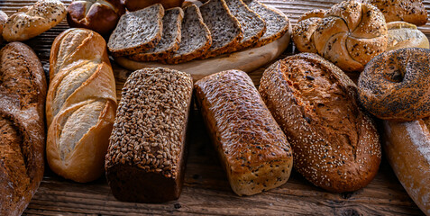 Assorted bakery products including loaves of bread and rolls