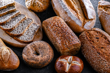 Assorted bakery products including loaves of bread and rolls