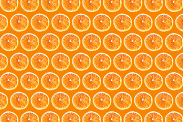 Vibrant dry orange fruit slices isolated on orange color background. Fruit sections design texture....