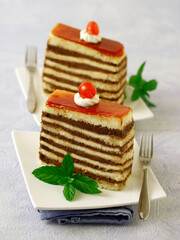 Cakes with chocolate and cherries.