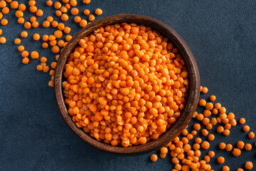 Uncooked lentils on black background