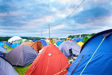 Camping, tents and outdoor music festival in park on holiday or vacation in summer. Camp, site and...