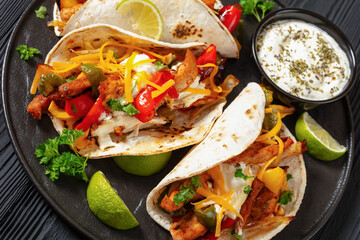baked tex-mex chicken fajitas on a plate, top view