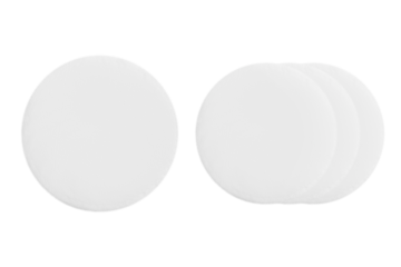 Cotton round cosmetic sponges on a blank background