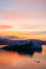 Jookulsarlon Glacier Lagoon in Iceland surrounded by blue waters at sunset