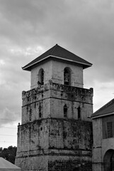 Grayscale shot of the bell tower of Baclayon Church. Bohol, Philippines.