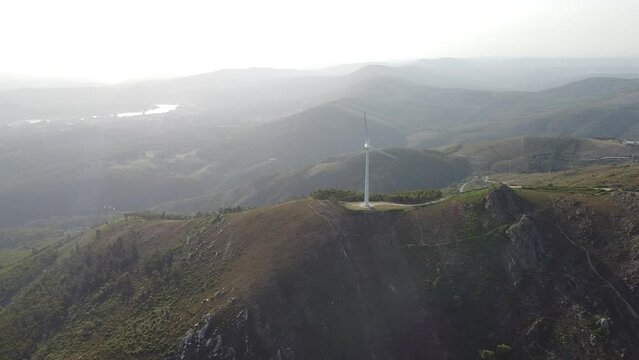 Drone footage of the wind turbines in Serra da Freita Arouca Geopark with gray misty sky in Portugal