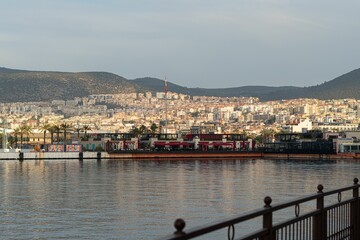 large boats are on the water in front of a city