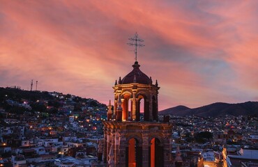 Stunning aerial view of a church and a small town during a beautiful sunset