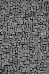 gray tiles on the wall made up of tiny squares and blocks