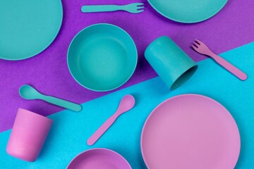 Crockery including a pink and blue plate