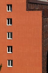 Fototapeta na wymiar Minimalist European building with side windows.