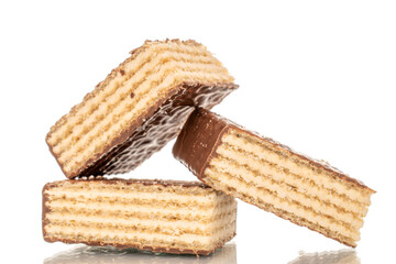 Several sweet chocolate wafers, macro, isolated on white background.