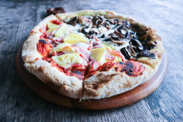 Hawaiian pizza and pesto mushroom pizza ,half and half topping pizza or split half topping pizza