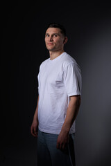 Fototapeta premium This captivating minimalist portrait features a man in a quiet embrace