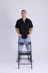 In this captivating minimalist portrait, a man emanates strength and quiet confidence. 