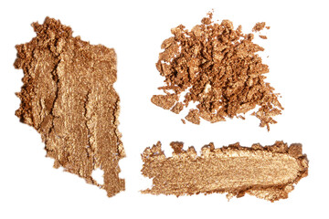 Set of glitter scattering and smear of gold-colored shadows against a blank background