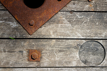 Rusty nut on old wood texture