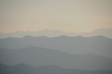 Majestic peaks of a mountain range on a misty day
