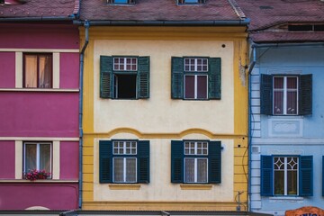 Vibrant row of residential buildings with a variety of colorful painted exteriors