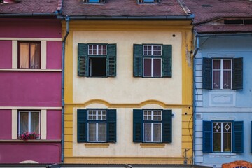 Vibrant row of residential buildings with a variety of colorful painted exteriors