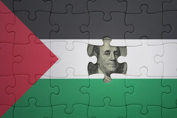 puzzle with the national flag of palestine and usa dollar banknote. finance concept
