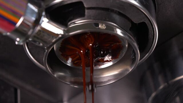 coffee extraction process with a espresso machine using a bottomless portafilter. Proper grind setting and good flow