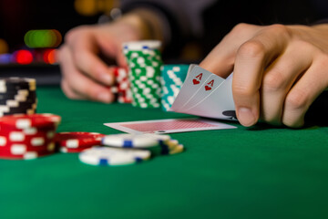 Naklejka premium Close-up of vibrant casino chips stacked on a gambling table, colorful chip stacks background and gambler's hands. poker texas hold 'em strategy hand investment investment pot