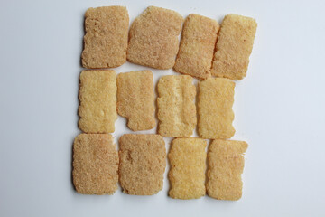 Rice crackers with powder flavoring, flat lay or top view, isolated on white background