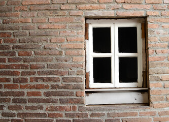 window of a brick house in the city