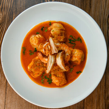 Recipe for Armorican-style monkfish tail, prawns, flambees with cognac, High quality photo