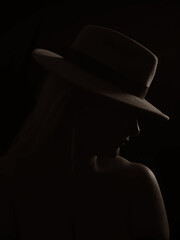 silhouette photo with a hat on a black background
