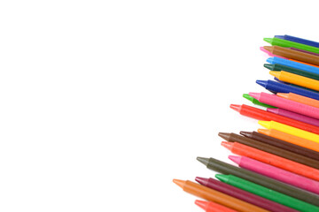 Crayons lined up isolated on white background.