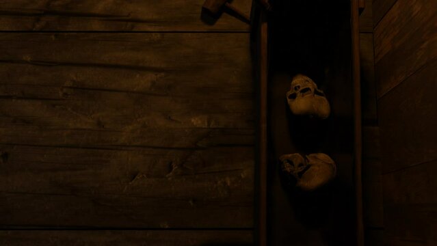 There are skulls in a wooden box. 3D animation.
