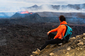 Traveler women near volcano in Iceland in 2023. Travel extreme concept. Hiking in Iceland. Girl...