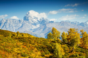 An attractive view of distant mountain slopes on a sunny day. Georgia country, Main Caucasian ridge.