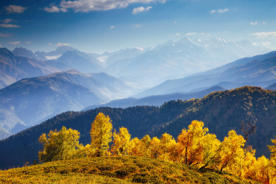 An attractive view of distant mountain slopes on a sunny day. Georgia country, Main Caucasian ridge. © Leonid Tit