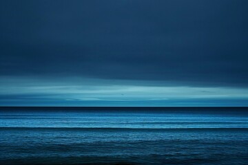 Beautiful seascape with dark clouds over the sea,  long exposure - obrazy, fototapety, plakaty