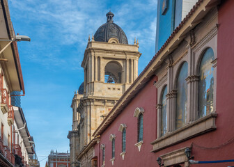 Fototapeta premium Streets of the old city center of La Paz with Cathedral Basilica of Our Lady of Peace in the background,, Bolivia.
