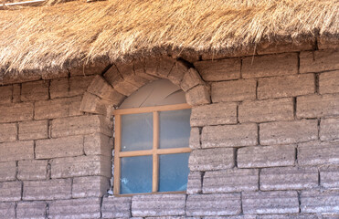 Traditional house construction with salt block and thatched roofs, Salar de Uyuini, the world's largest salt flat, Bolivian altiplano