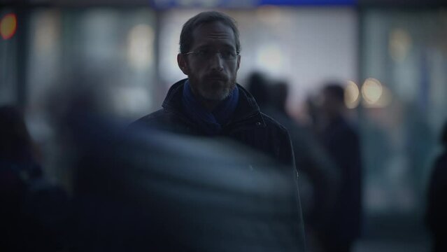 Portrait of Thoughtful Man Thinking Worried Looking at People Commuting