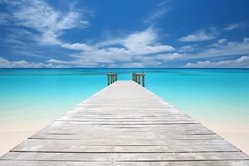 Rolgordijnen Wooden pier on tropical beach with turquoise water and blue sky © Starlit