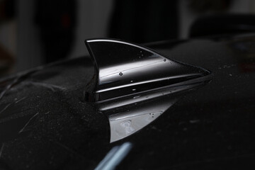 Shark fin car antenna. The radio antenna on the roof of the car.