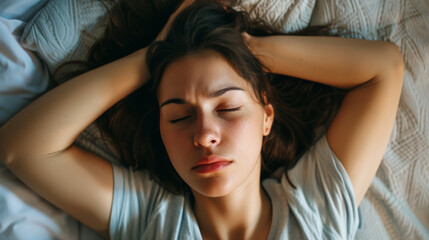 Naklejka premium A sleepless man suffers from insomnia, sleep apnea, or stress. Tired and exhausted guy. Headache or migraine. Awake in the night. A frustrated person with problem Tired and exhausted guy.
