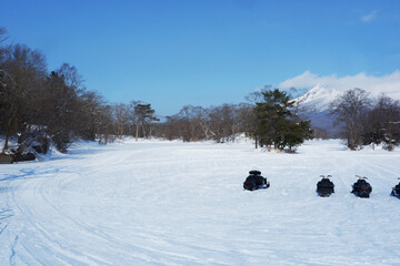 A view of the park in winter after it snows.