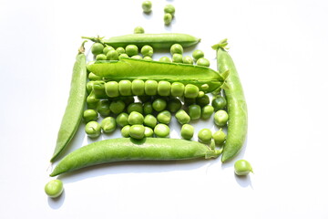 Fresh green pea on white background. There is a lot of vitamins  and Minerals in it. The pea is most commonly the small spherical seed or the seed. Popular vegetable of all over world. 