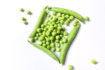 Fresh green pea on white background. There is a lot of vitamins  and Minerals in it. The pea is most commonly the small spherical seed or the seed. Popular vegetable of all over world. 