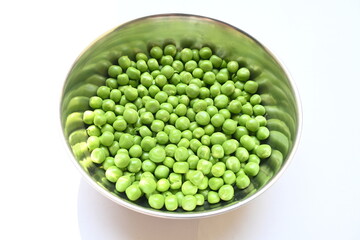 Fresh green pea on white background. There is a lot of vitamins  and Minerals in it. The pea is most commonly the small spherical seed or the seed. Popular vegetable of all over world. 